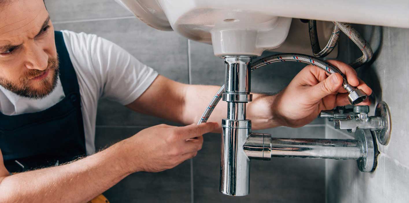 Plumber Attaching Water Pipes Plumber Attaching Water Pipes